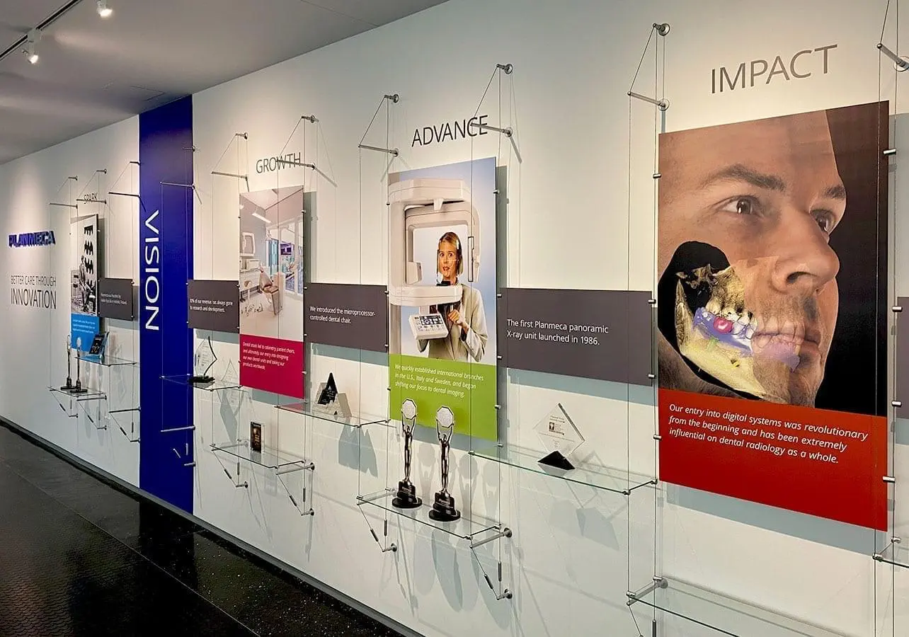 C1036 — Cable Suspended Wall Display Showcasing Company Achievements