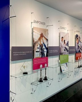C1035 — Cable Suspended Recognition Wall Display with Graphics, Signage and Shelves