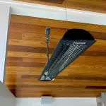 Cable hang heating unit from vaulted ceiling outdoor covered patio