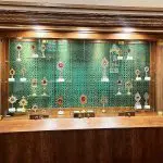 Cable Suspended Glass Shelf Display Showcasing Relics from Catholic Giants at Holy Family Columbus