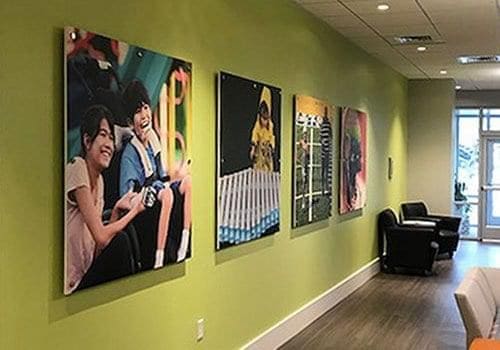 Frameless Acrylic Poster Displays Mounted on Standoffs