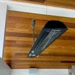 Cable hang heating unit from vaulted ceiling outdoor covered patio