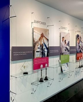 C1035 — Cable Suspended Recognition Wall Display with Graphics, Signage and Shelves