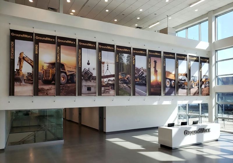 H2022 — Corporate Product Wall Display / Graphic Banners Suspended with Cable Systems | Design Concept