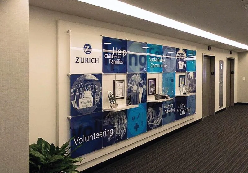 W2502 — Award Wall Display with Custom Acrylic Graphic Panels and Showcase Displays