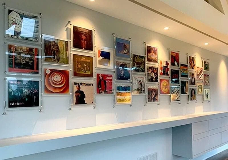 cable-suspended-magazine-and-vinyl-records-display-with-frosted-acrylic-frames cable-suspended-magazine-and-vinyl-records-display-with-frosted-acrylic-frames